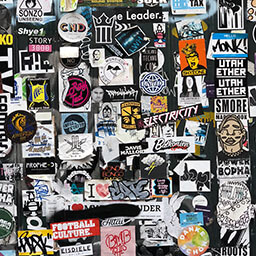 A wall of stickers filled with logos.